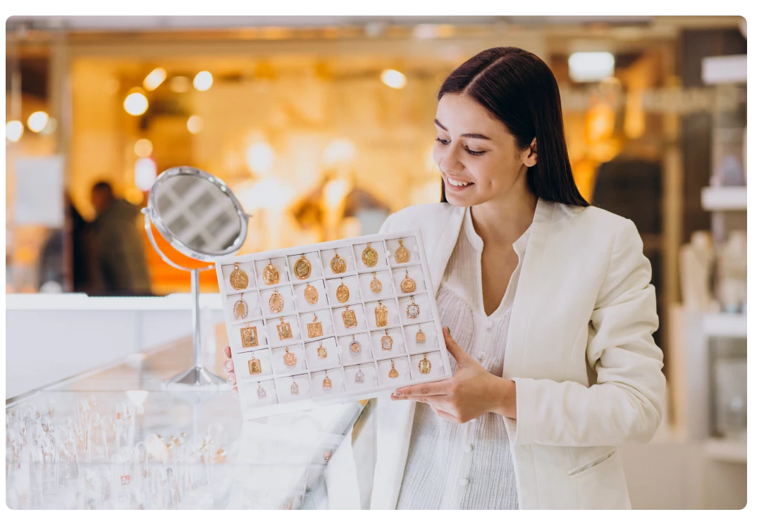 Women displaying jewellery at store